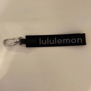 Black and white Lululemon keychain